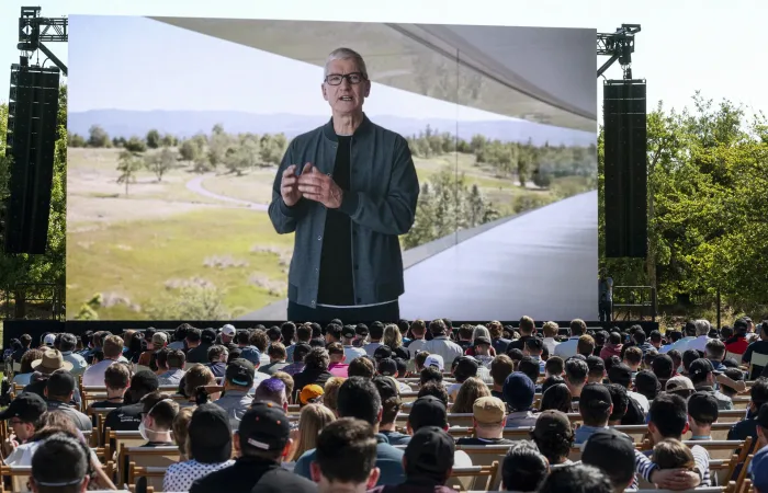 An impressive outdoor LED screen displaying a captivating video presentation during an Apple event, creating an immersive visual experience for attendees